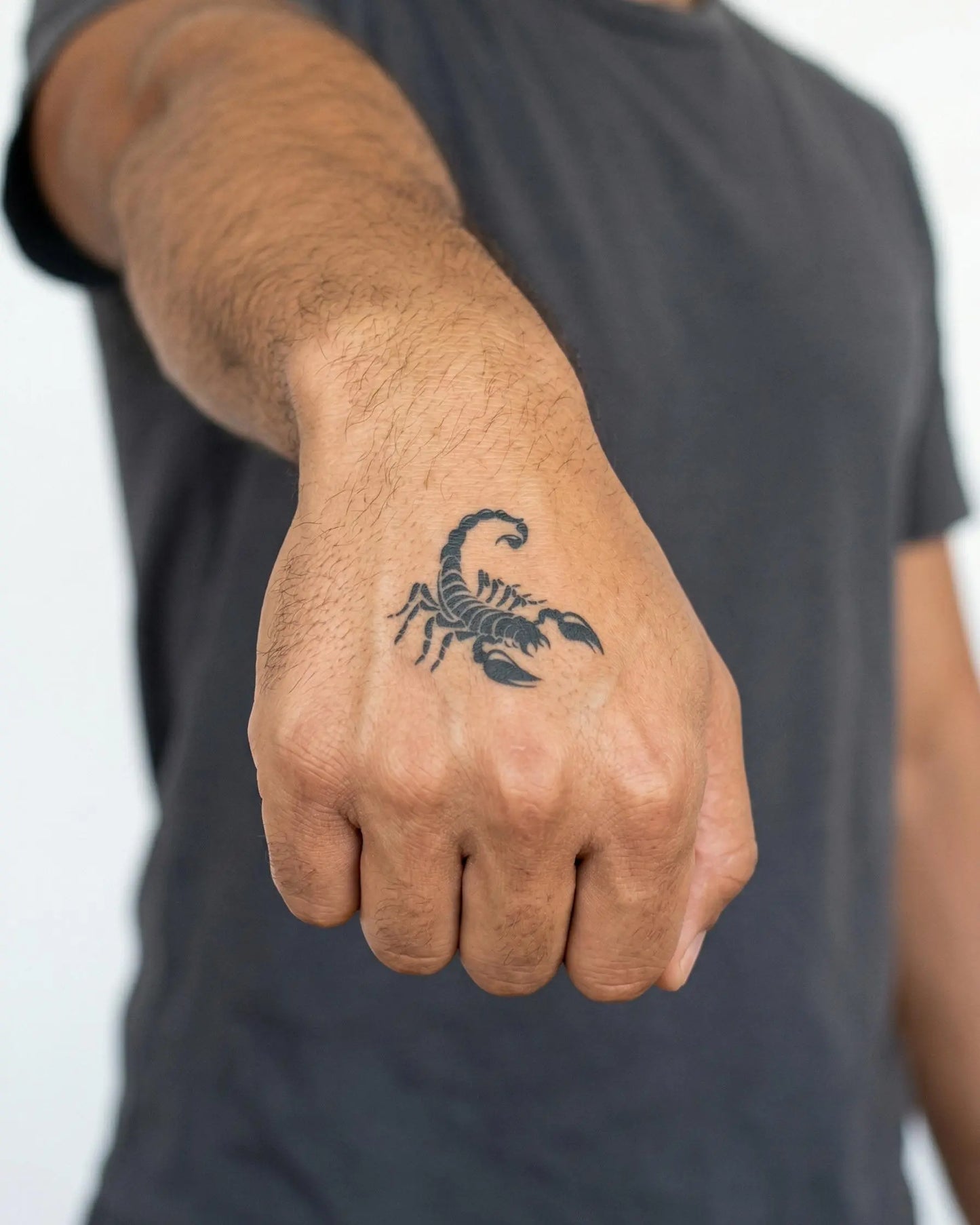 INKON Scorpion semi-permanent tattoo applied on a man – 2 x 2 in (5x5cm) design, realistic ink look, lasts 10 days