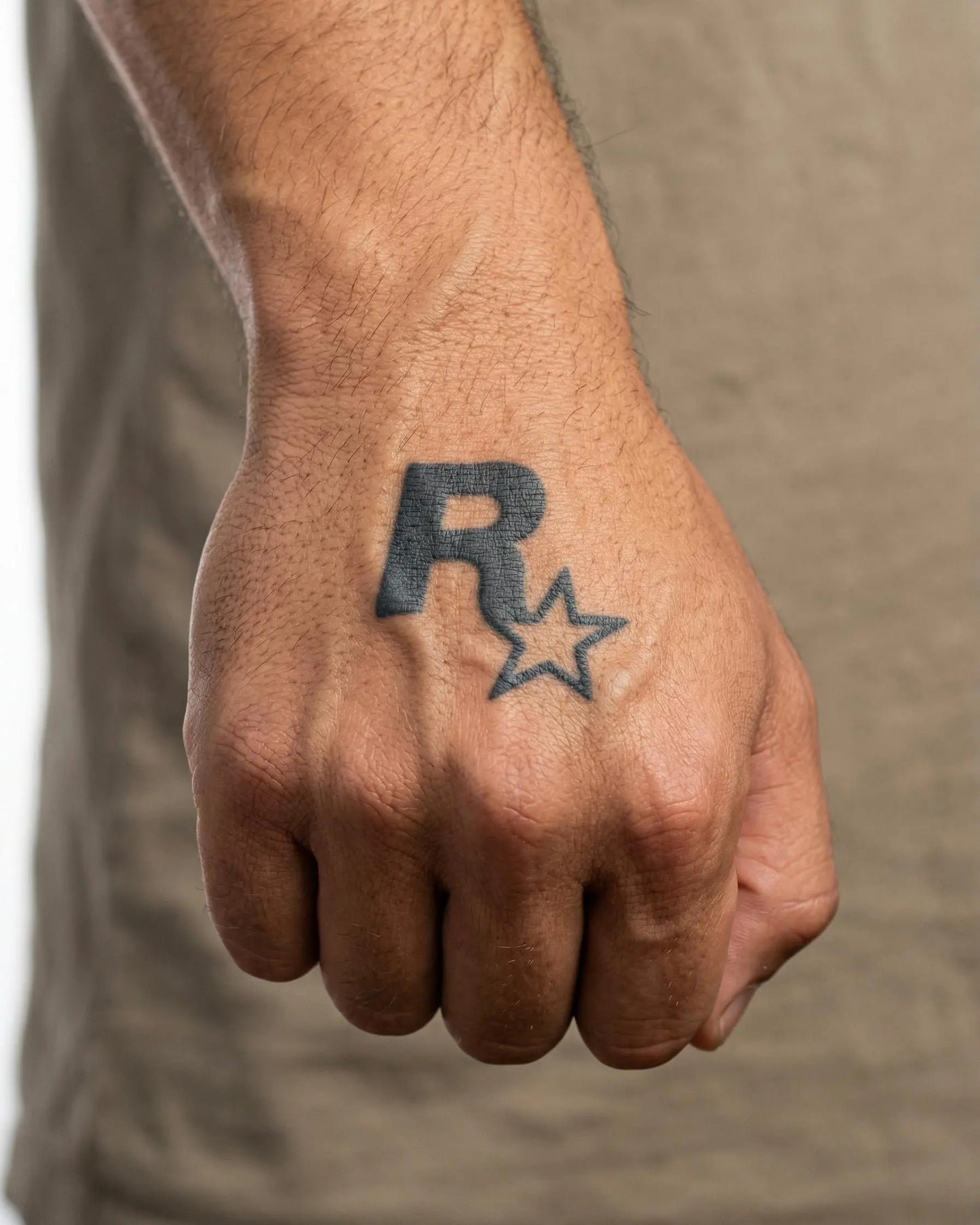 INKON R Star Logo semi-permanent tattoo applied on a man – 2 x 2 in (5x5cm) design, realistic ink look, lasts 10 days