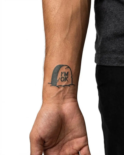INKON I'm OK Tombstone semi-permanent tattoo applied on a man – 2 x 2 in (5x5cm) design, realistic ink look, lasts 10 days