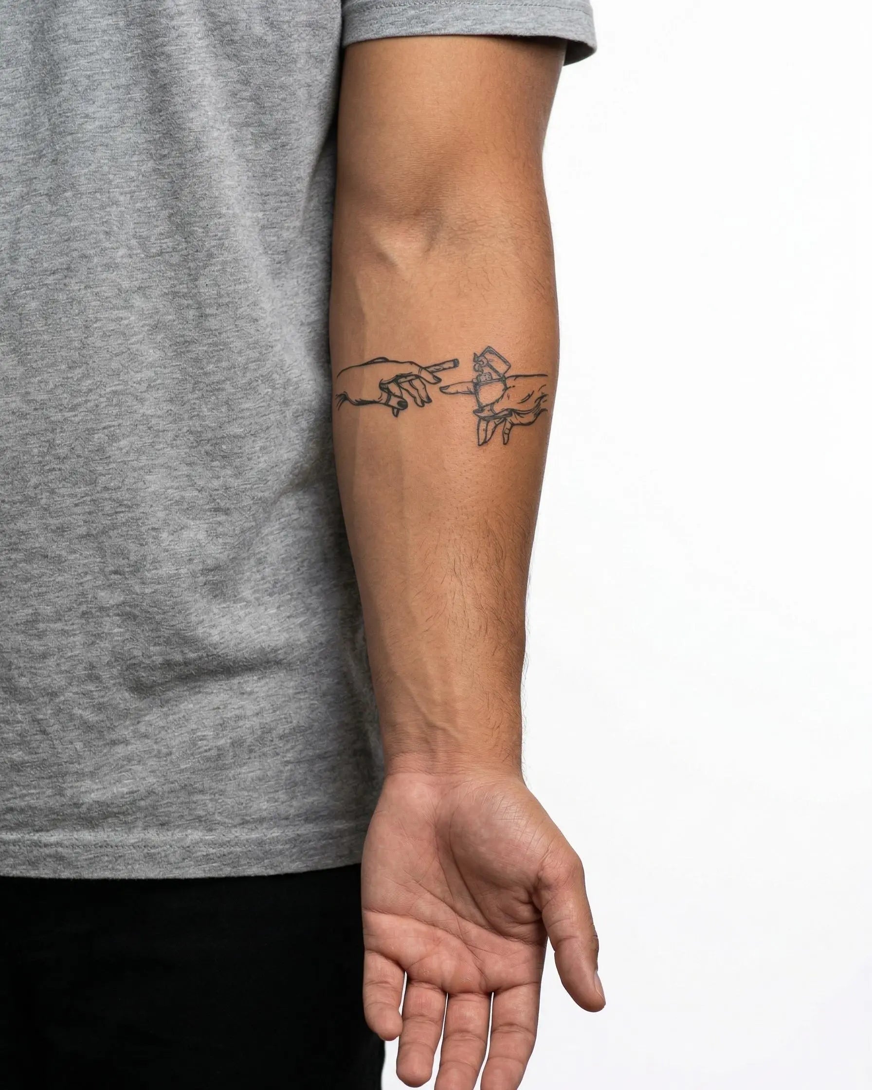 INKON Hands with Lighter & Cigarette semi-permanent tattoo applied on a man – 4 x 4 in (9x9cm) design, realistic ink look, lasts 10 days