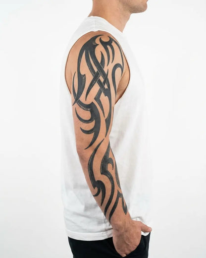 INKON Flowing Tribal Sleeve semi-permanent tattoo applied on a man – 8 x 20 in (20x50cm) design, realistic ink look, lasts 10 days